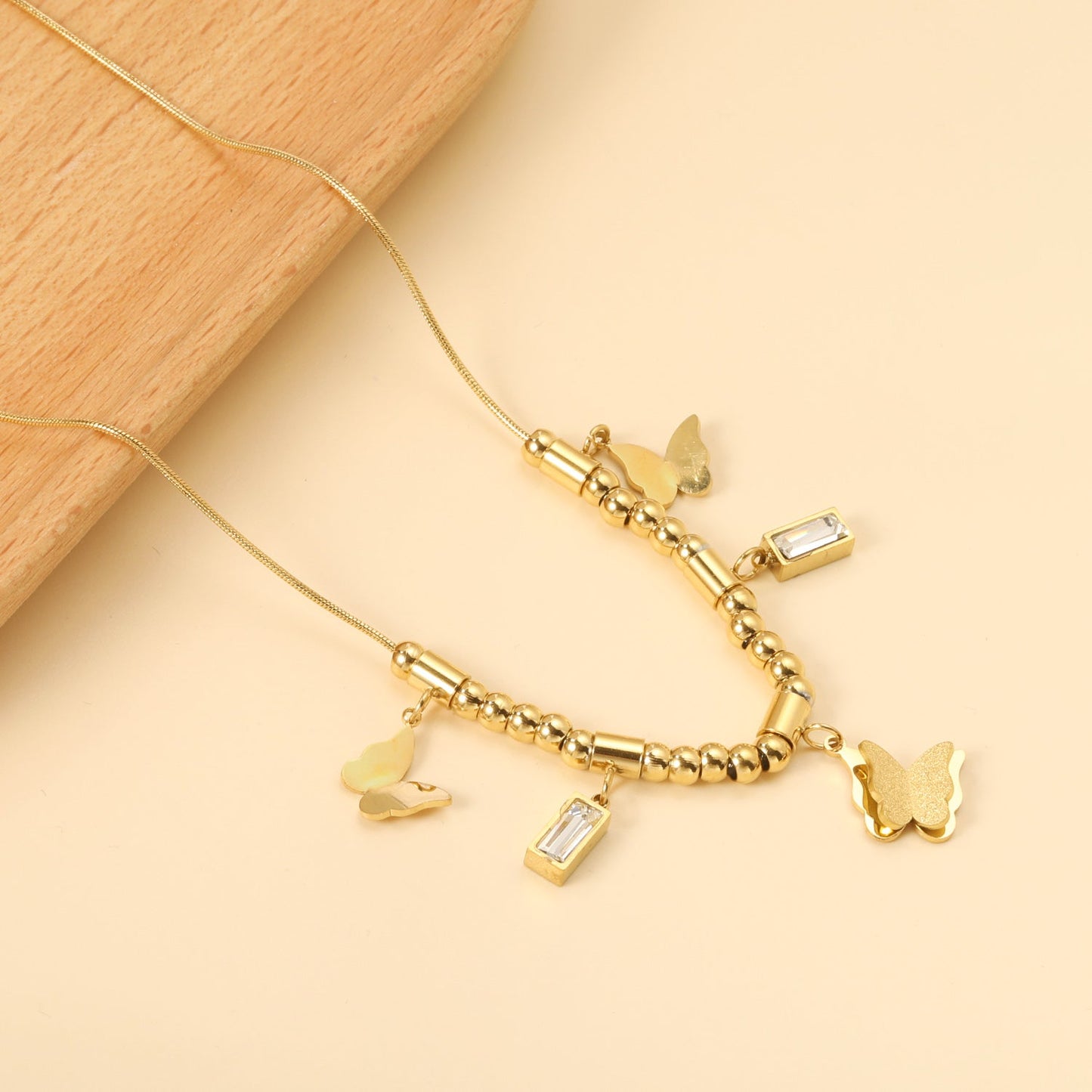 3 size butterflies 12*10mm+2 rectangular white diamond pendants 4.3*8.3mm+22 round through beads+5 round through posts Necklace 41+5cm Gold color asonjewelry