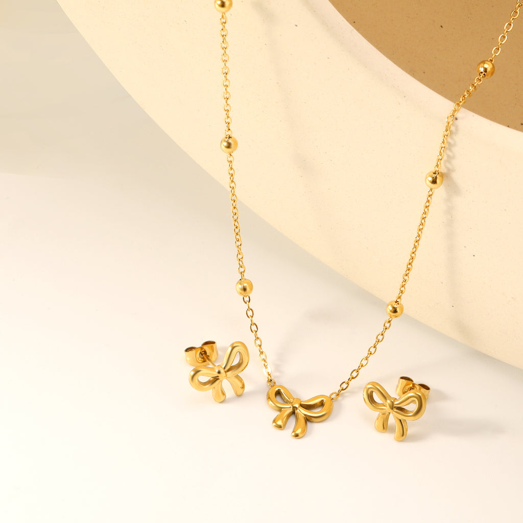 Bowtie set Golden earrings:13.2*11.2mm Pendant:13.2*11.2mm 40+5cm+6mm round plaque