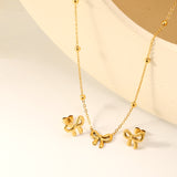 Bowtie set Golden earrings:13.2*11.2mm Pendant:13.2*11.2mm 40+5cm+6mm round plaque