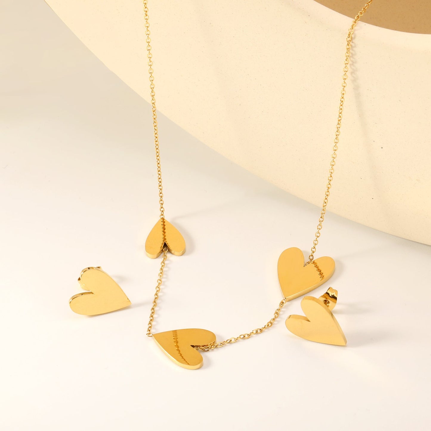 Peach heart set Gold-colored earrings:1.2*12*15mm Pendant:10*12+12*15+13*17mm 0.3 Cross chain*40+5cm+6mm round plaque asonjewelry