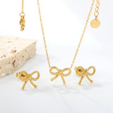 Bow Set Steel Color Earrings:13.2*11.2mm Necklace:13.2*11.2mm0.3 Cross Chain*40+5cm+6mm Round Plaque