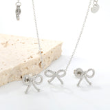 Bow Set Steel Color Earrings:13.2*11.2mm Necklace:13.2*11.2mm0.3 Cross Chain*40+5cm+6mm Round Plaque