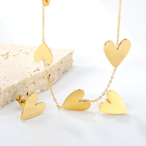 Peach heart set Gold-colored earrings:1.2*12*15mm Pendant:10*12+12*15+13*17mm 0.3 Cross chain*40+5cm+6mm round plaque