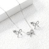 Bow Set Steel Color Earrings:13.2*11.2mm Necklace:13.2*11.2mm0.3 Cross Chain*40+5cm+6mm Round Plaque