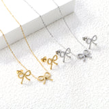 Bow Set Steel Color Earrings:13.2*11.2mm Necklace:13.2*11.2mm0.3 Cross Chain*40+5cm+6mm Round Plaque