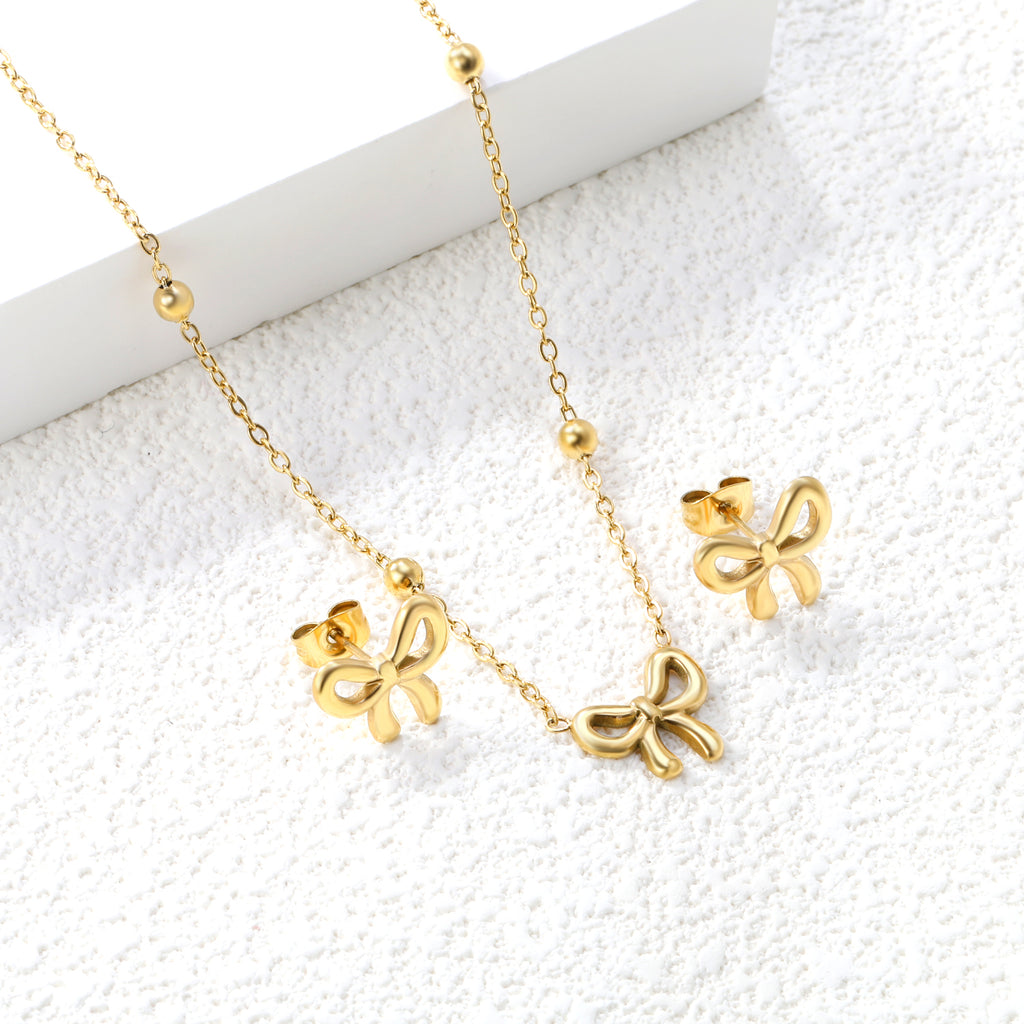 Bowtie set Golden earrings:13.2*11.2mm Pendant:13.2*11.2mm 40+5cm+6mm round plaque