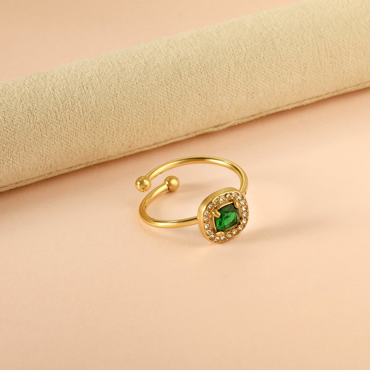 Square green diamond with small white diamonds ending in an open round bead ring asonjewelry