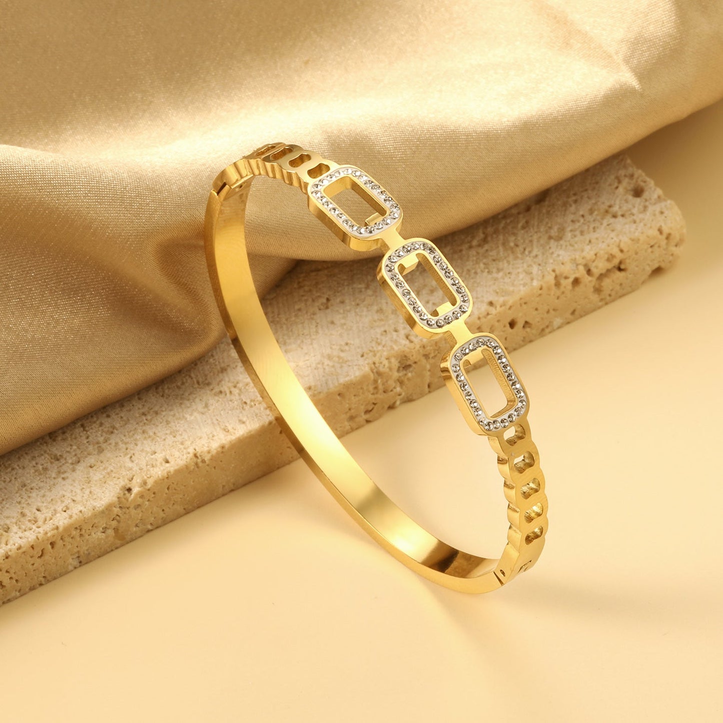 Rigid square bracelet with three strands of small diamonds asonjewelry