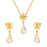 Flower + drop white diamond set Steel / Gold Earrings: 8.3mm flower + 6.2*10mm drop white diamond Pendant: 8.9mm flower + 6.2*10mm drop white diamond 0.3 Cross chain 42+5cm+6mm round plate