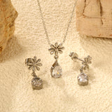 Flower + drop white diamond set Steel / Gold Earrings: 8.3mm flower + 6.2*10mm drop white diamond Pendant: 8.9mm flower + 6.2*10mm drop white diamond 0.3 Cross chain 42+5cm+6mm round plate