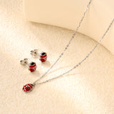 Seven star ladybug set Steel color/golden earrings: 7.3*8.2mm Pendant: 7.3*8.8mm0.3 Cross chain 40+5cm+6mm round plate