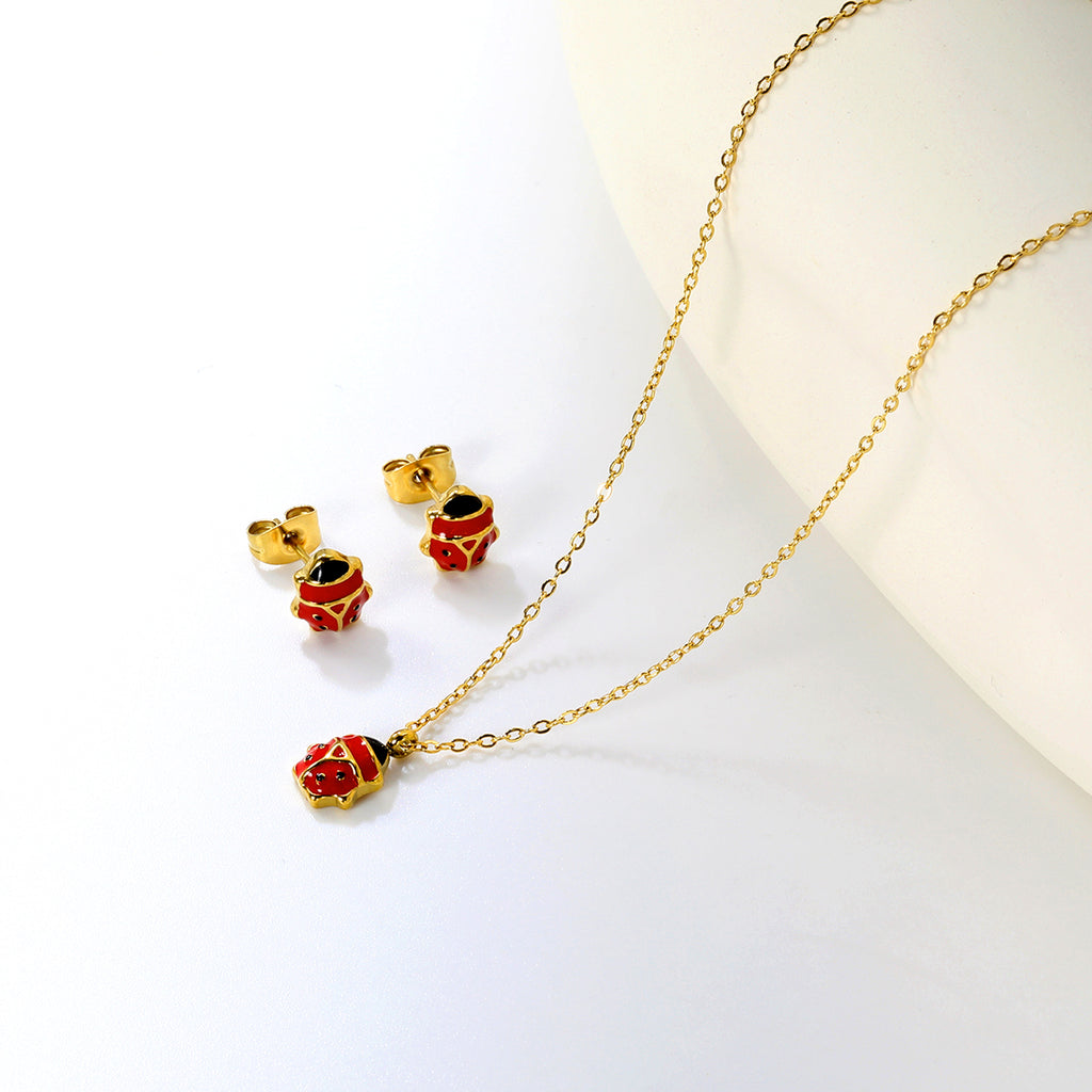 Seven star ladybug set Steel color/golden earrings: 7.3*8.2mm Pendant: 7.3*8.8mm0.3 Cross chain 40+5cm+6mm round plate