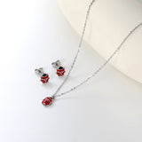 Seven star ladybug set Steel color/golden earrings: 7.3*8.2mm Pendant: 7.3*8.8mm0.3 Cross chain 40+5cm+6mm round plate