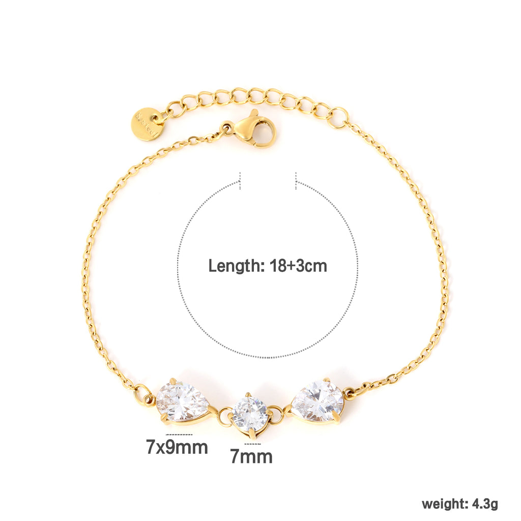 7*9mm pear-shaped white/blue diamonds, 7mm round white diamond, cross chain 18+3cm + 6mm round pendant tag, bracelet, gold