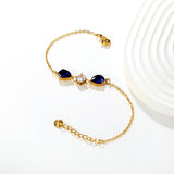 7*9mm pear-shaped white/blue diamonds, 7mm round white diamond, cross chain 18+3cm + 6mm round pendant tag, bracelet, gold