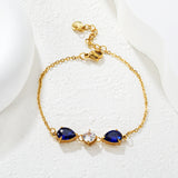 7*9mm pear-shaped white/blue diamonds, 7mm round white diamond, cross chain 18+3cm + 6mm round pendant tag, bracelet, gold