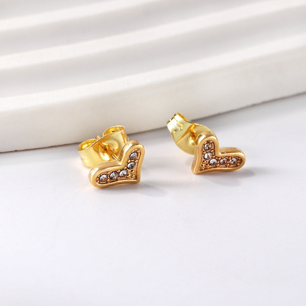 Boucles d'oreilles en or taille cœur torsadé avec diamants