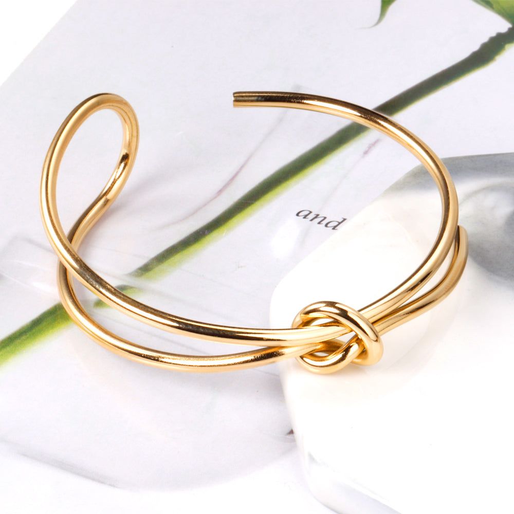 Hard bangle with minimalist clasp shape in gold color asonjewelry