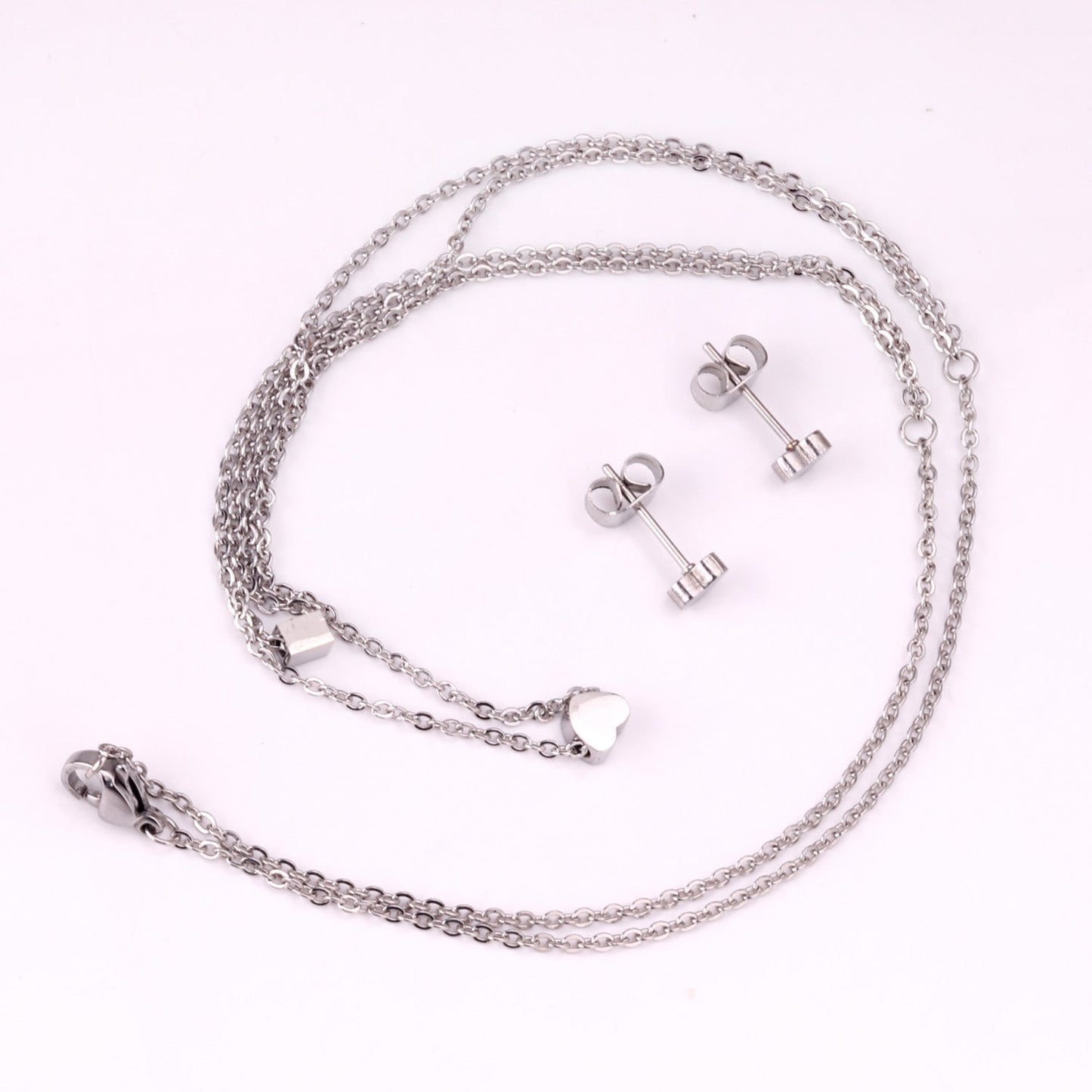 Gold/steel two-chain pendant jewelry set with rectangle and heart shapes asonjewelry