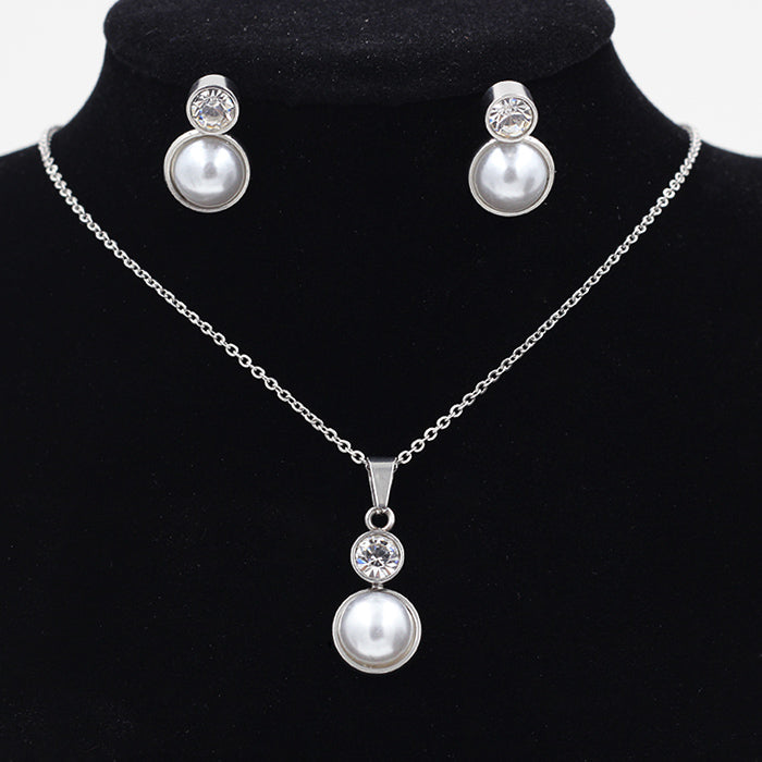 Gold/steel-colored sticky pearl set + a small round cake with diamonds on top asonjewelry