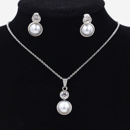 Gold/steel-colored sticky pearl set + a small round cake with diamonds on top asonjewelry