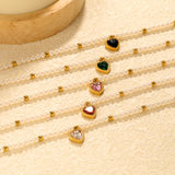 8.5 x 8.8mm beaded heart-shaped pendant with white/black/red/pink/green zirconia stones, 3.2mm white pearl beads + 3mm small steel beads, 18+3cm + 6mm round pendant, gold-colored bracelet
