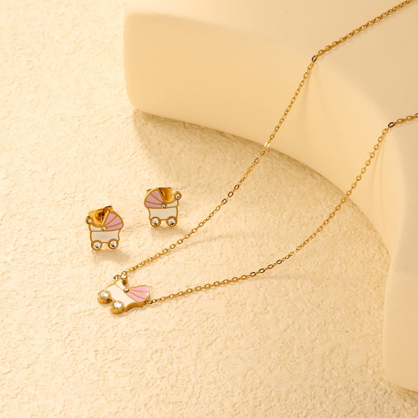 Pink and white rocking bed oil-dripping set with diamonds. Earrings: 9.8 x 10mm. Pendant: 10.5 x 12mm. 0.3mm cross chain 42+5cm + 6mm round pendant. Gold/steel color. asonjewelry