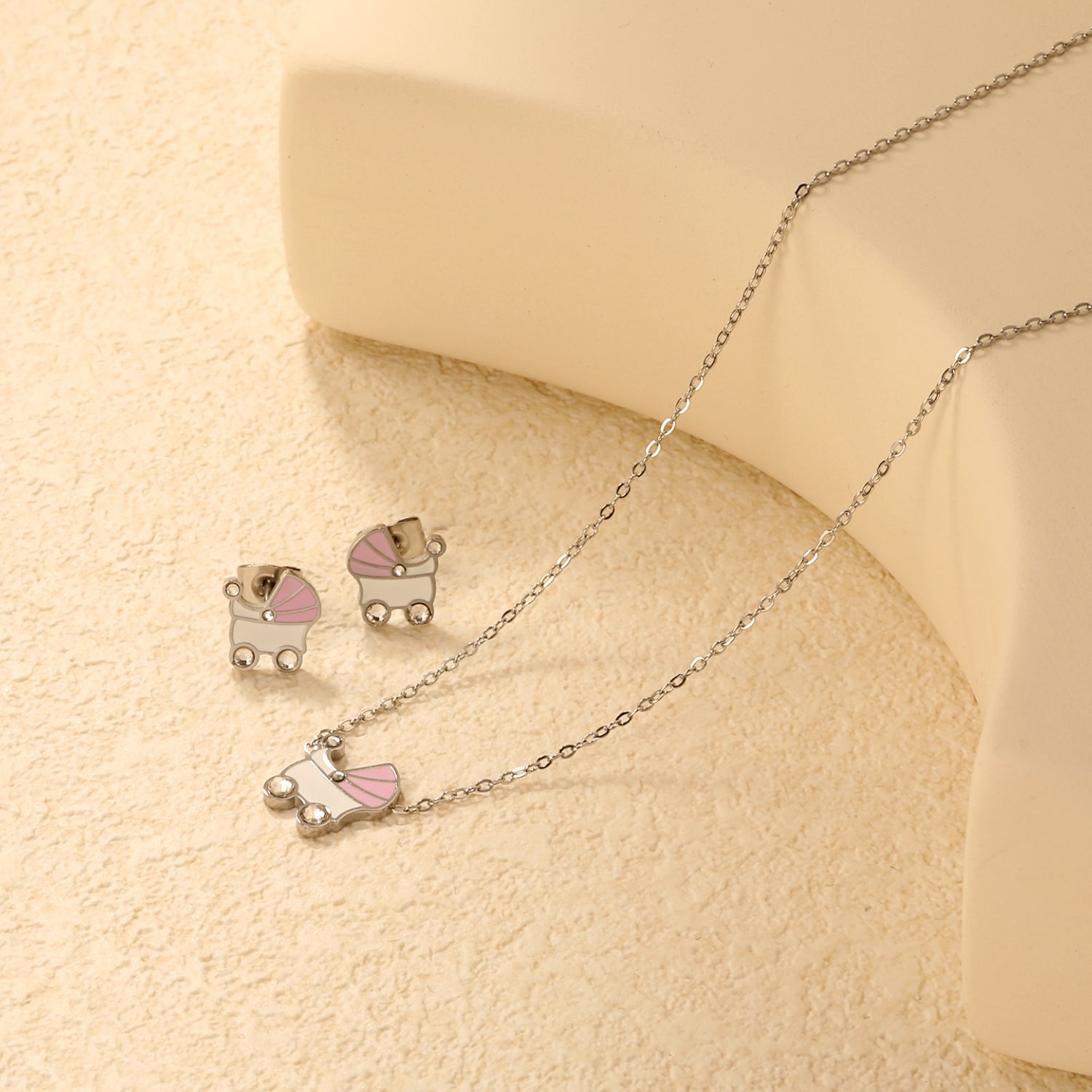 Pink and white rocking bed oil-dripping set with diamonds. Earrings: 9.8 x 10mm. Pendant: 10.5 x 12mm. 0.3mm cross chain 42+5cm + 6mm round pendant. Gold/steel color. asonjewelry