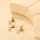 Heart-shaped white diamond + pearl set, gold. Ear studs: 8x9mm heart-shaped white diamond + 10mm pearl earring. Pendant: 8x9mm heart-shaped white diamond + 10mm pearl pendant. 0.3 cross chain 40+5cm + 6mm round pendant.