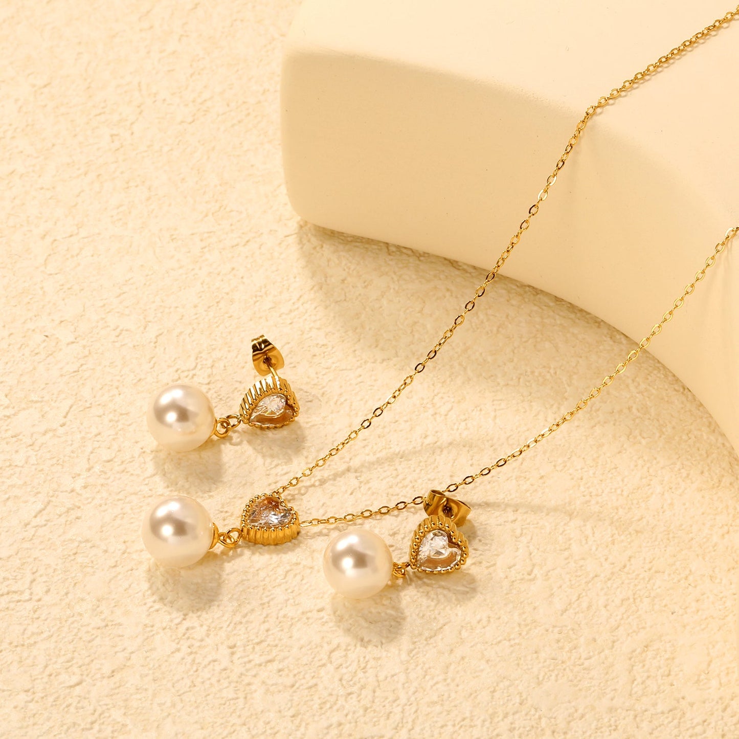 Heart-Shaped White Zirconia + Pearl Set Gold Ear Studs: 8.5mm Heart-Shaped White Zirconia + Pearl Earrings 10mm Pendant: 8.5mm Heart-Shaped White Zirconia + Pearl Pendant 10mm 0.3 Cross Chain 40+5cm+6mm Round Pendant asonjewelry