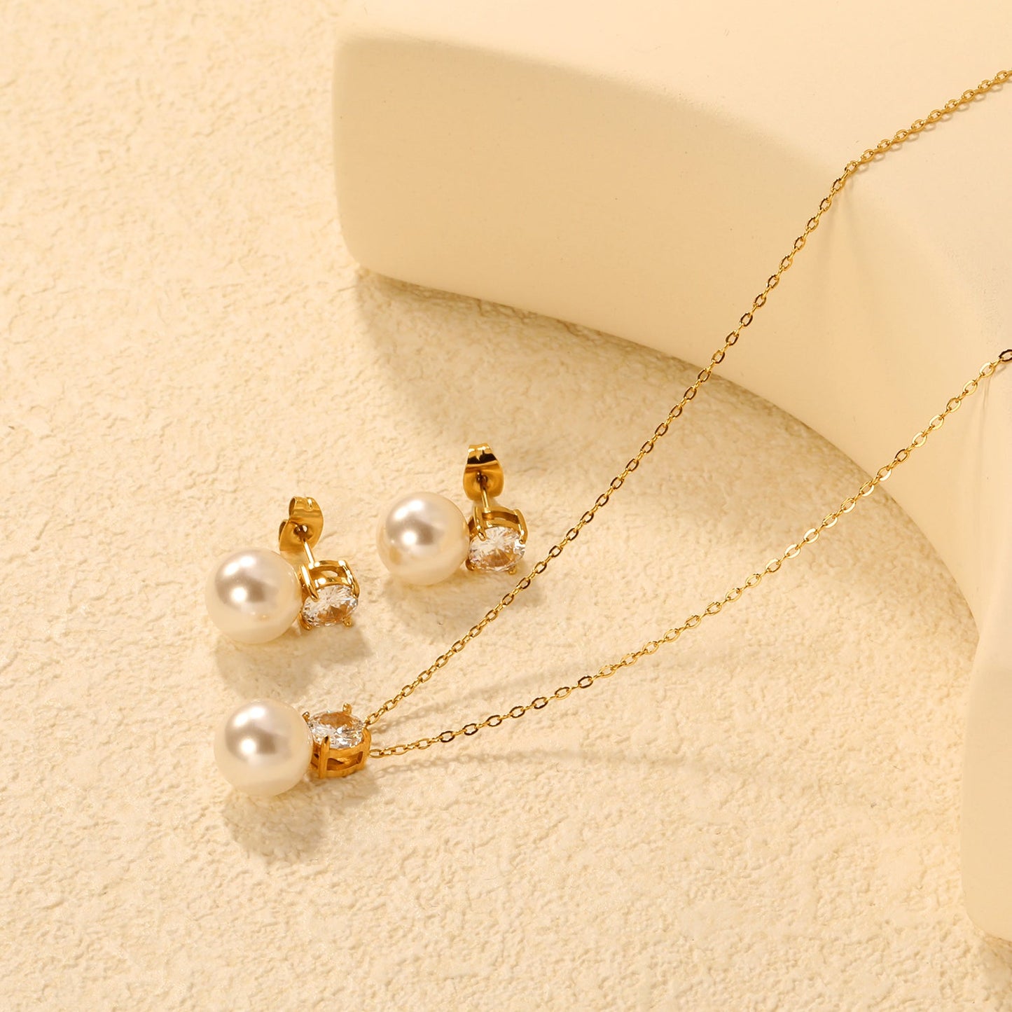 Round White Zirconia + Pearl Set Gold Earrings: 6mm Round White Zirconia + Pearl Earrings 10mm Pendant: 6mm Round White Zirconia + Pearl Pendant 10mm 0.3mm Cross Chain 40+5cm + 6mm Round Pendant asonjewelry
