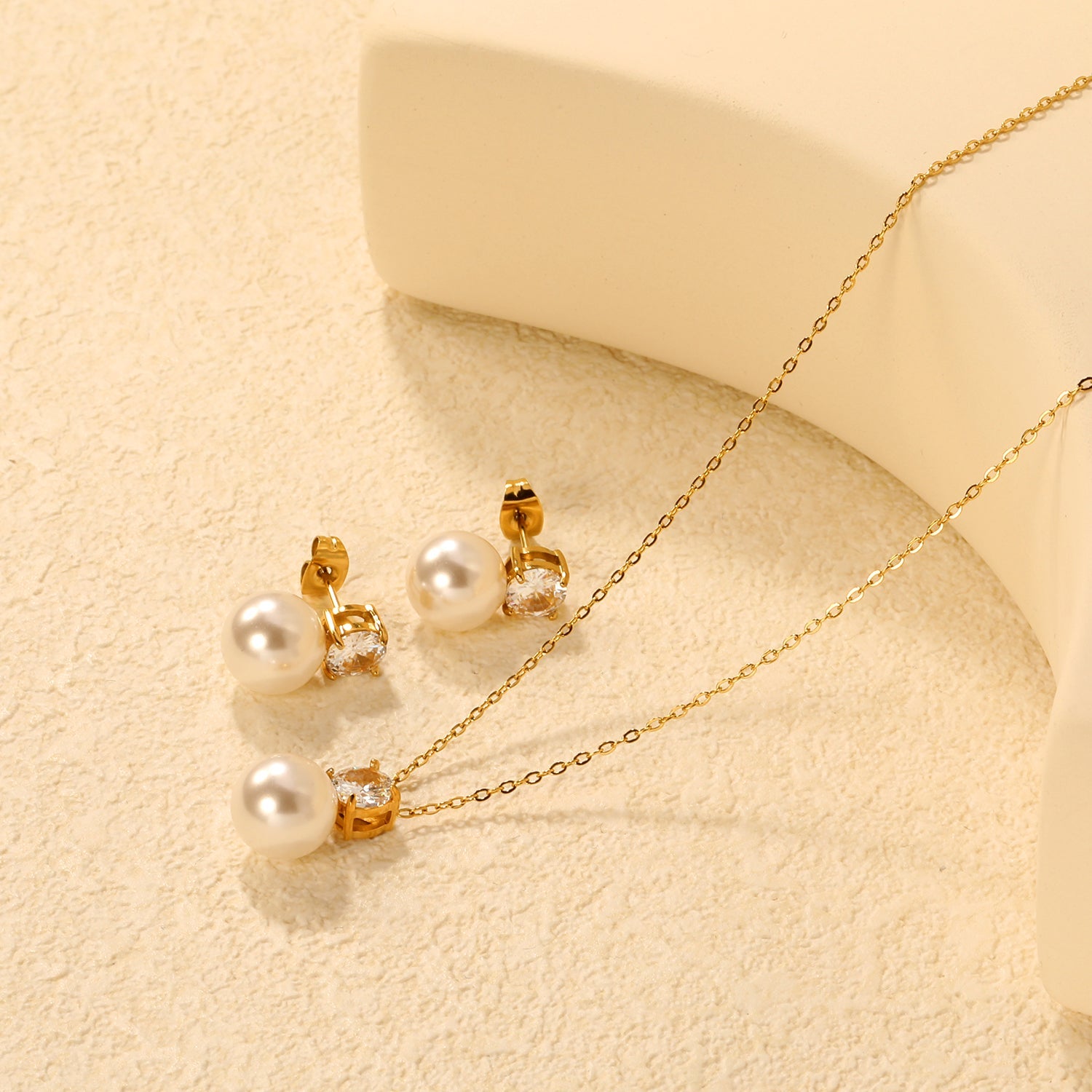 Round White Zirconia + Pearl Set Gold Earrings: 6mm Round White Zirconia + Pearl Earrings 10mm Pendant: 6mm Round White Zirconia + Pearl Pendant 10mm 0.3mm Cross Chain 40+5cm + 6mm Round Pendant asonjewelry