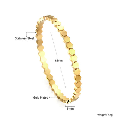 Hard bracelet with diamonds strung together with small gold-colored discs asonjewelry
