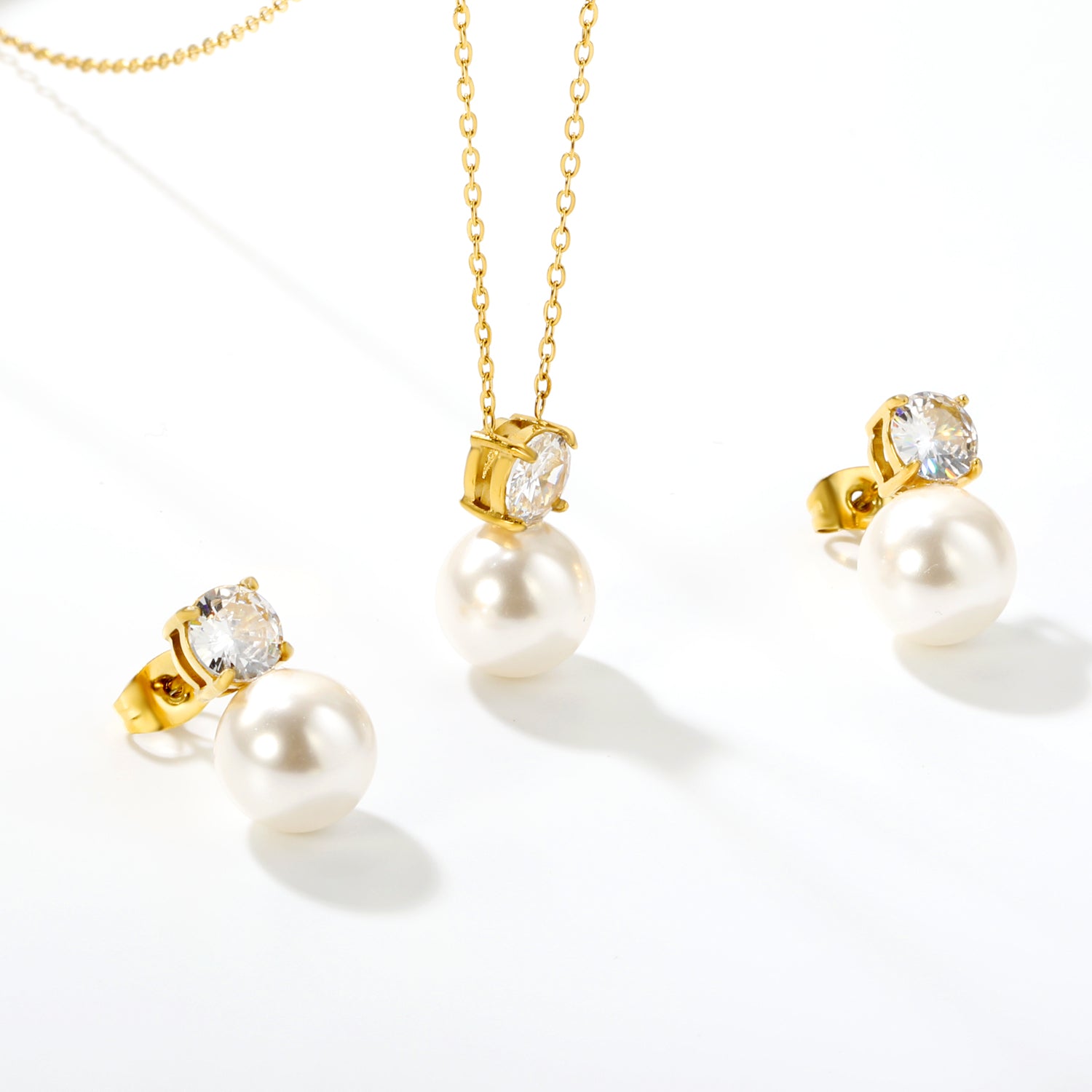 Round White Zirconia + Pearl Set Gold Earrings: 6mm Round White Zirconia + Pearl Earrings 10mm Pendant: 6mm Round White Zirconia + Pearl Pendant 10mm 0.3mm Cross Chain 40+5cm + 6mm Round Pendant asonjewelry