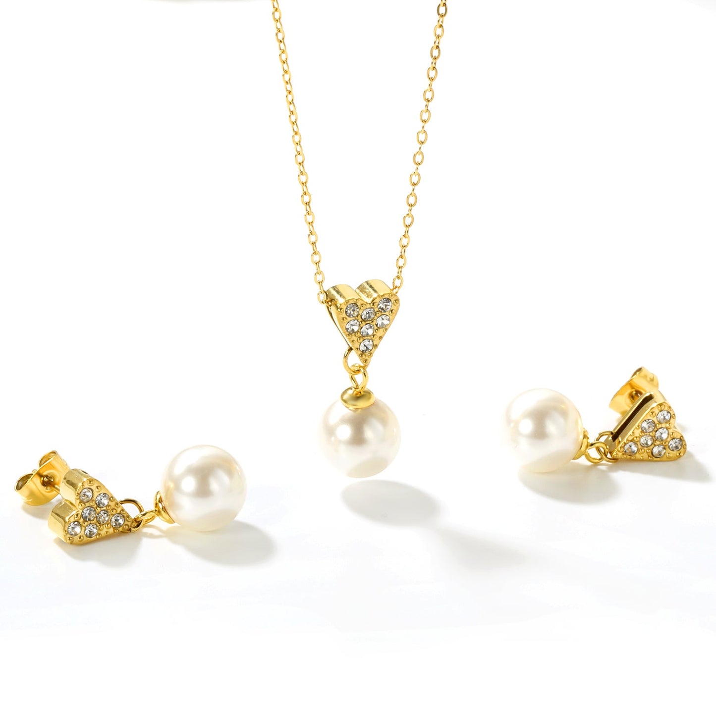 Heart-shaped white diamond + pearl set, gold. Ear studs: 8x9mm heart-shaped white diamond + 10mm pearl earring. Pendant: 8x9mm heart-shaped white diamond + 10mm pearl pendant. 0.3 cross chain 40+5cm + 6mm round pendant. asonjewelry