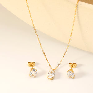Oval white zirconium set Gold-colored earrings: 6*8mm Pendant: 6*8mm 0.3 cross chain *40+5cm+6mm round plate