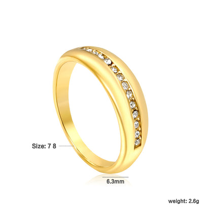 The center of the ring is set with a row of tiny diamonds asonjewelry