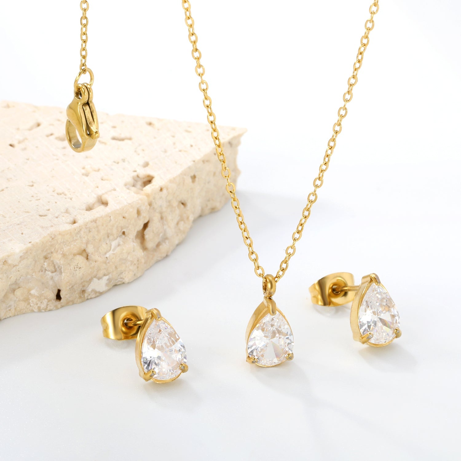 Teardrop white zirconium set Gold-colored earrings:6.1*9.4mm Pendant:6.1*9.4mm 0.3 cross chain*40+5cm+6mm round plaque asonjewelry