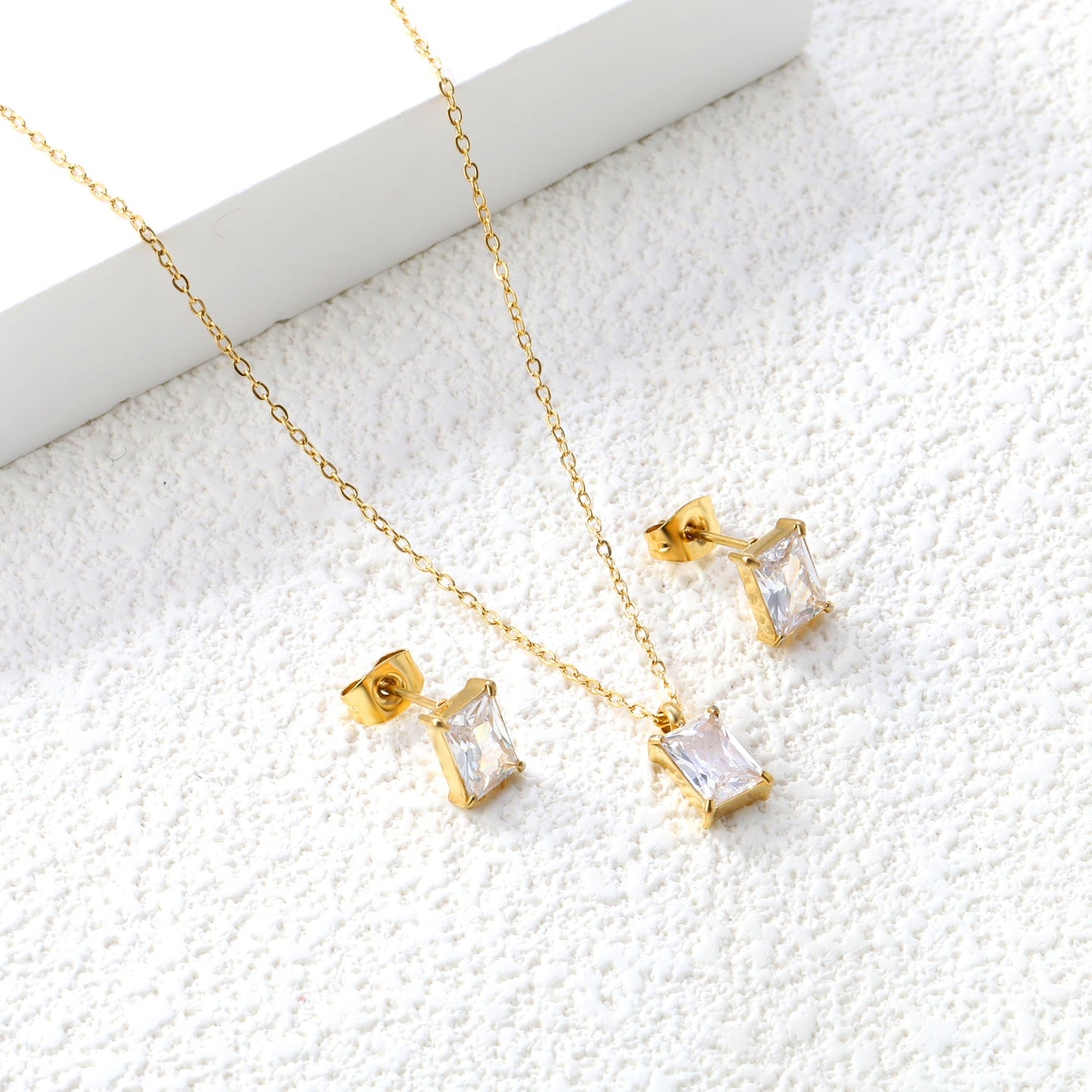 Rectangular white zirconium set Gold-colored earrings:5*7mm Pendant:5*7mm 0.3 cross chain*40+5cm+6mm round plate asonjewelry