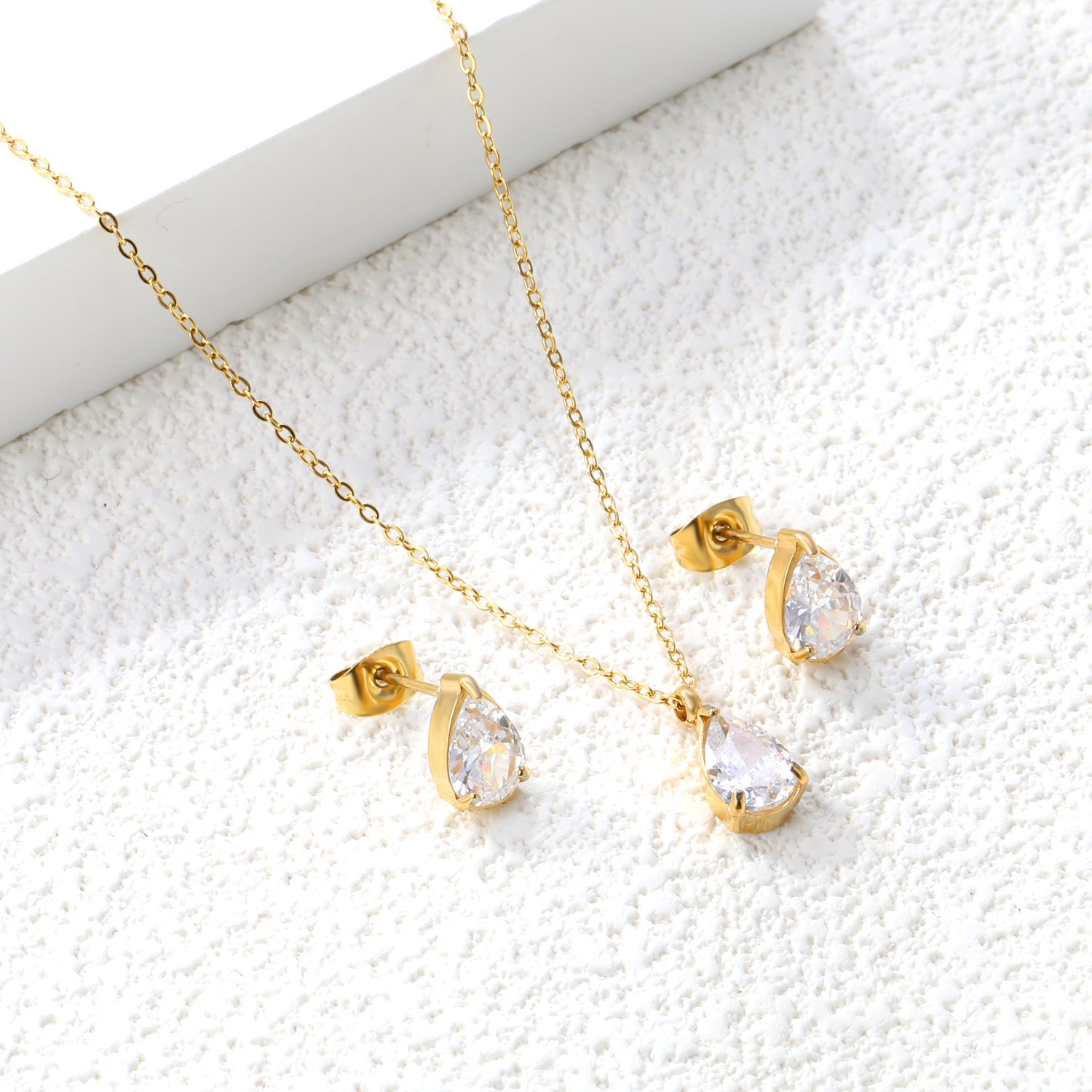 Teardrop White Zircon Set Gold/Steel-Tone Studs: 6.1*9.4mm Pendant: 6.1*9.4mm 0.3ct Cross Chain 40+5cm + 6mm Round Tag asonjewelry