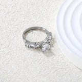 Stainless Steel Ring with Round Diamond & Emerald - Cut Side Accents