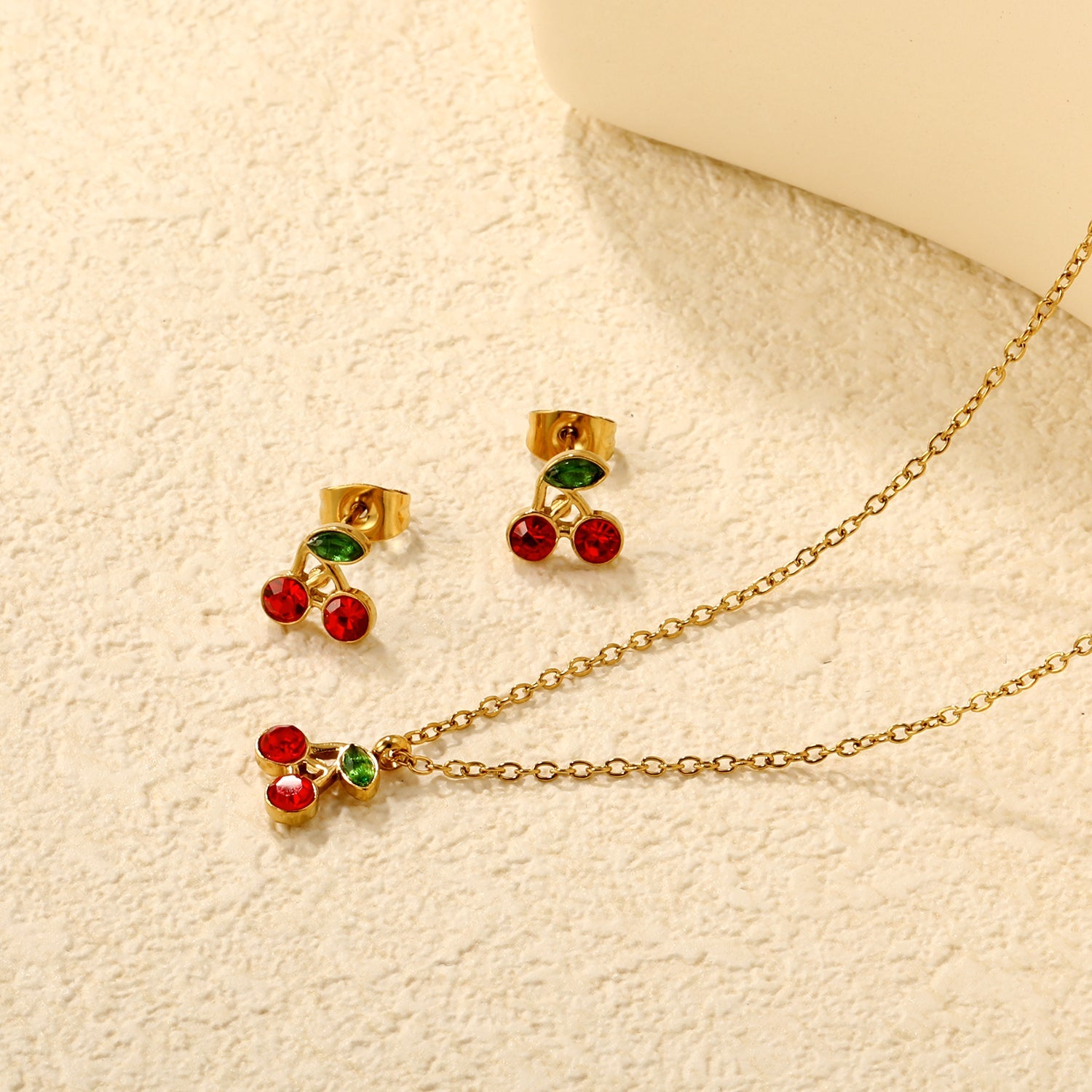 Cherry Set Gold Earrings: 8.5 x 8.5 mm Pendant: 8.5 x 8.5 mm 0.3 Cross Chain 40+5 cm + 6 mm Round Pendant asonjewelry
