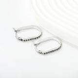 2.26 * 22mm oval-shaped geometric band with white/purple/blue/pink/orange diamonds, ear hooks, steel color