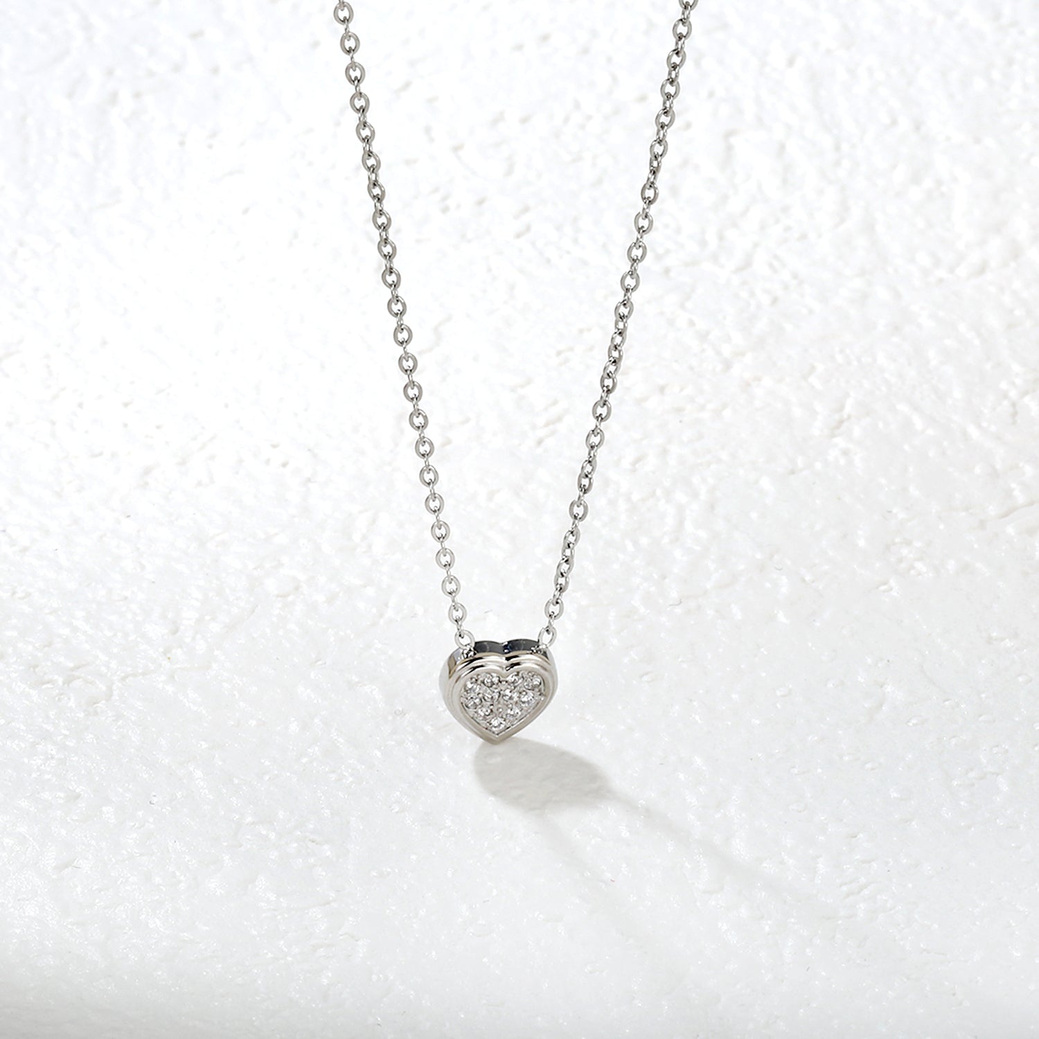 7.7 x 8mm beveled heart-shaped CNC white zirconia pendant with 0.3mm cross chain (40+5cm) and 6mm round tag necklace in steel gray/gold asonjewelry