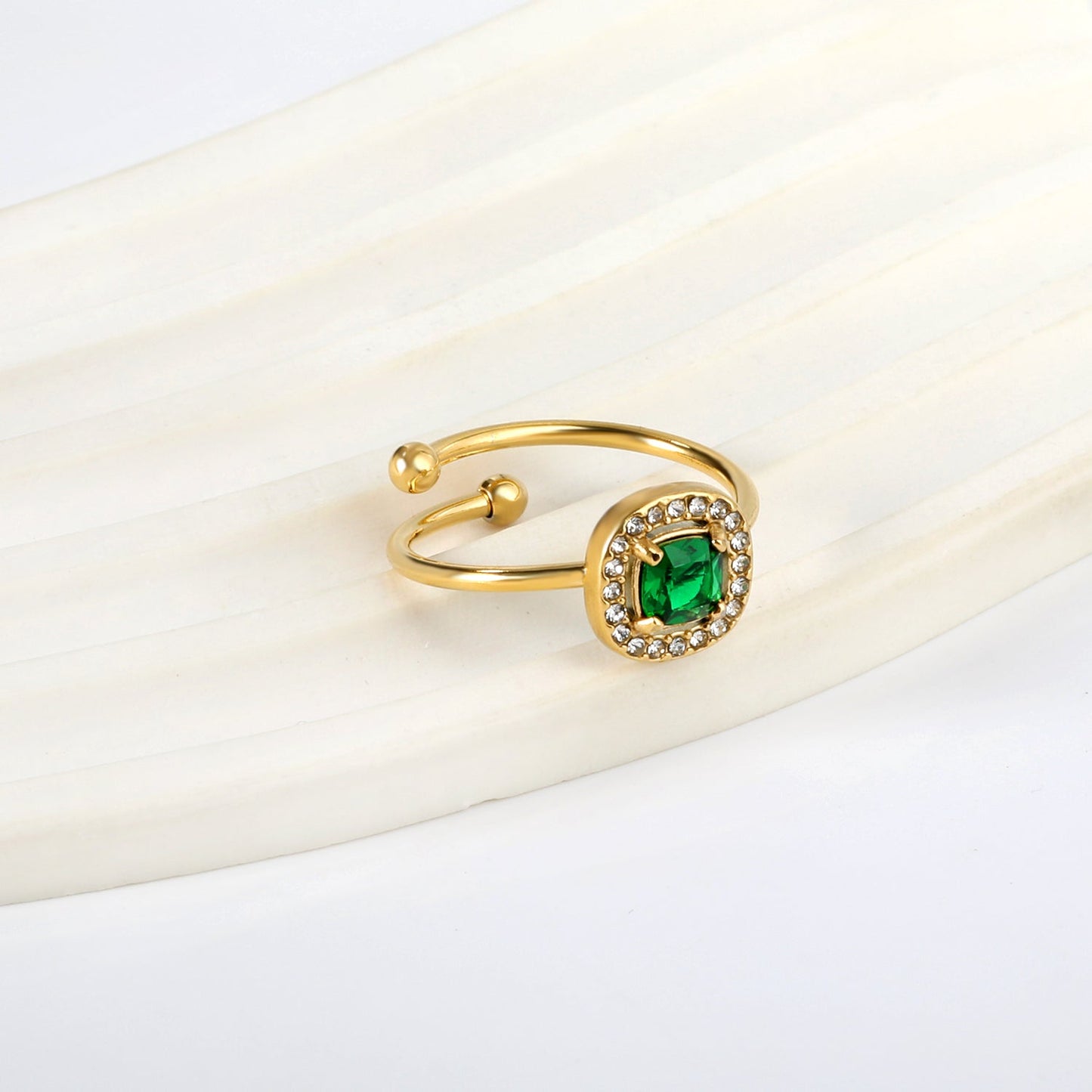 Square green diamond with small white diamonds ending in an open round bead ring asonjewelry
