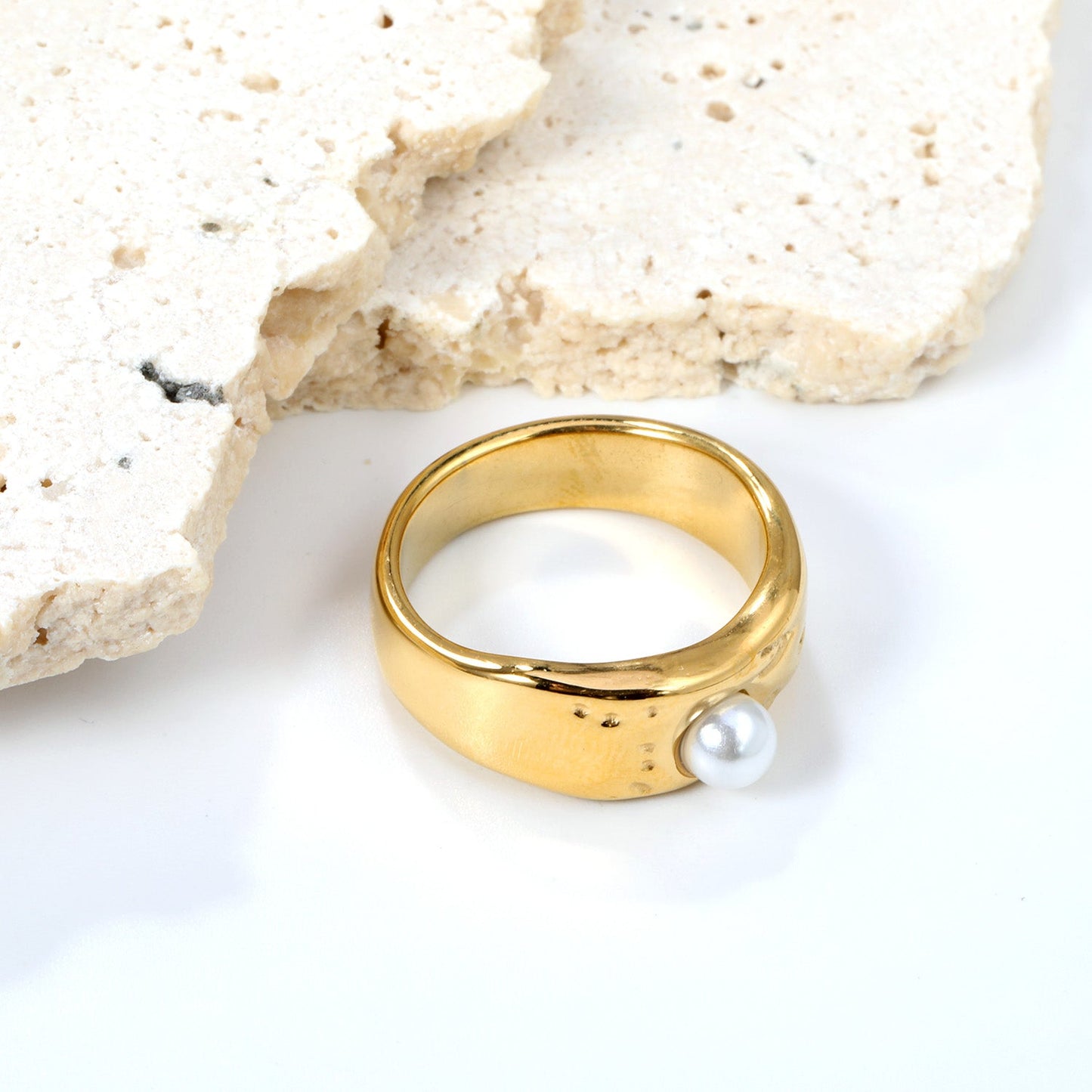 Gold-colored ring with a pearl surface asonjewelry