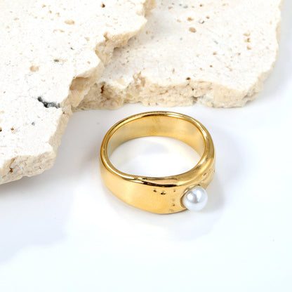 Gold-colored ring with a pearl surface asonjewelry