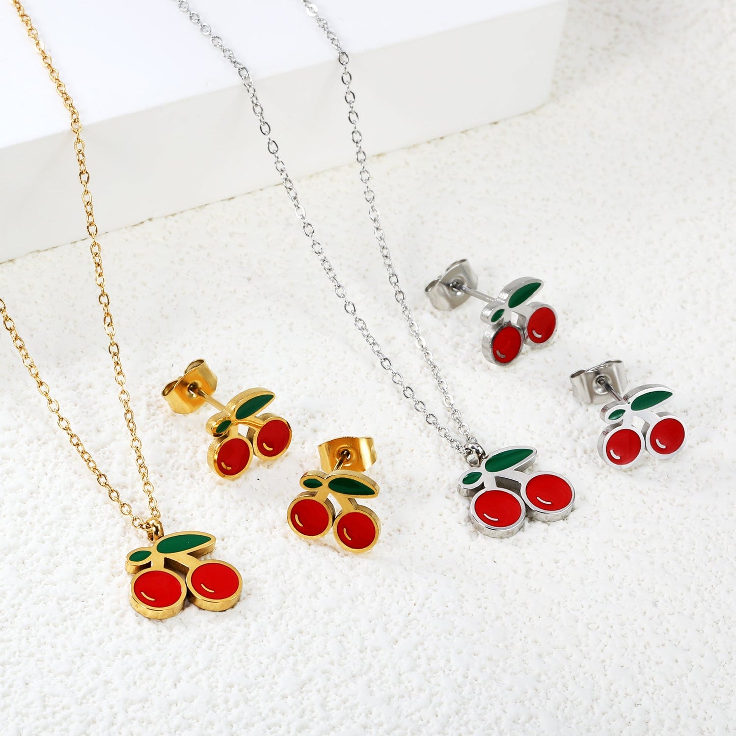 Cherry with red oil drops set Steel color/golden 0.3 cross 40+5cm+6mm round plaque earrings: 10.3*9mm pendant: 12.2*11mm asonjewelry