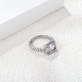 Oversized white diamonds on a threaded band ring.