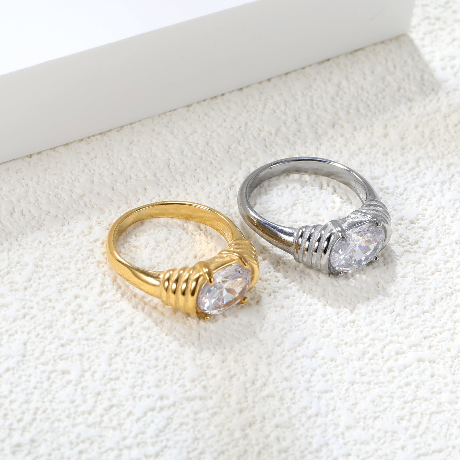 Oversized white oval diamonds on a threaded band ring. asonjewelry